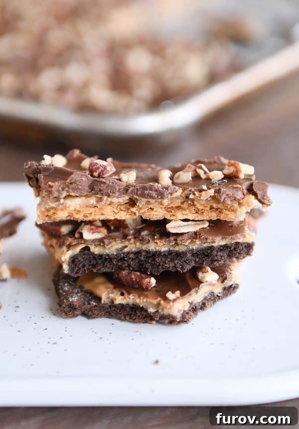 Effortless Peanut Butter Chocolate Graham Cracker Toffee 2 Stack of easy graham cracker toffee with peanut butter and chocolate layers, ready to be enjoyed.