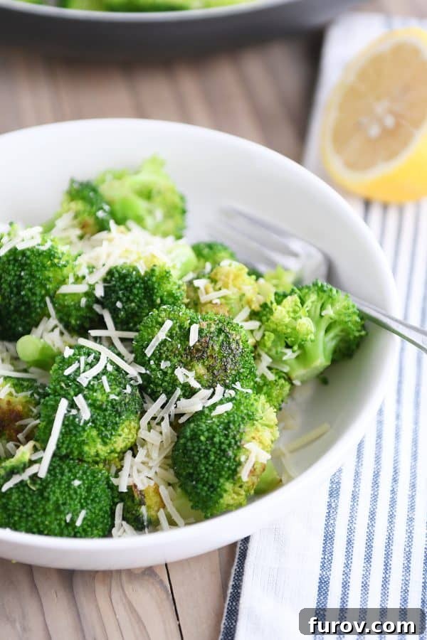5-Minute Skillet Broccoli Trio 3 White bowl with skillet broccoli and Parmesan.