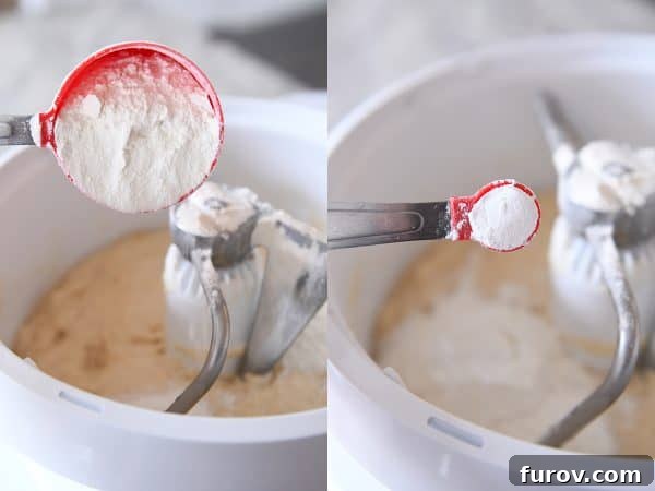 Master Cheryl's Famous Cinnamon Rolls: A Step-by-Step Guide to the Best Recipe and Baking Secrets 13 More flour, baking powder, baking soda, and salt being added to the risen sponge dough in a stand mixer bowl.