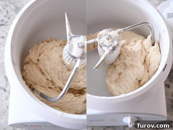 Master Cheryl's Famous Cinnamon Rolls: A Step-by-Step Guide to the Best Recipe and Baking Secrets 15 Cinnamon roll dough mixing in a Bosch stand mixer, now appearing smoother and more cohesive, indicating it's nearly ready.