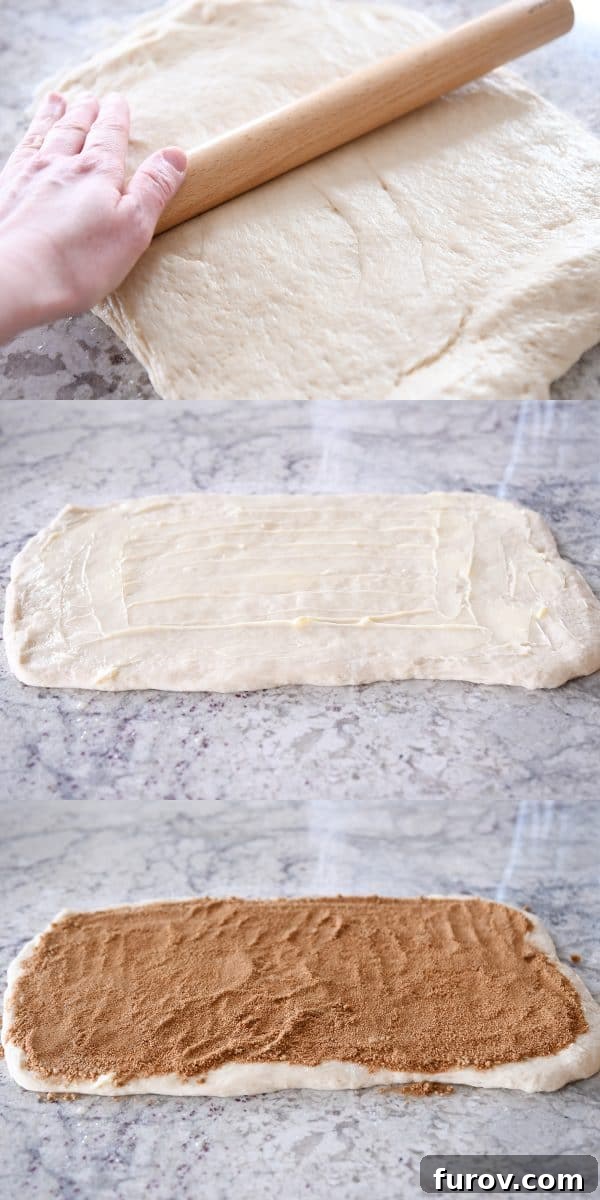 Master Cheryl's Famous Cinnamon Rolls: A Step-by-Step Guide to the Best Recipe and Baking Secrets 20 A large rectangle of cinnamon roll dough on a floured surface, spread with butter and generously sprinkled with cinnamon sugar filling.