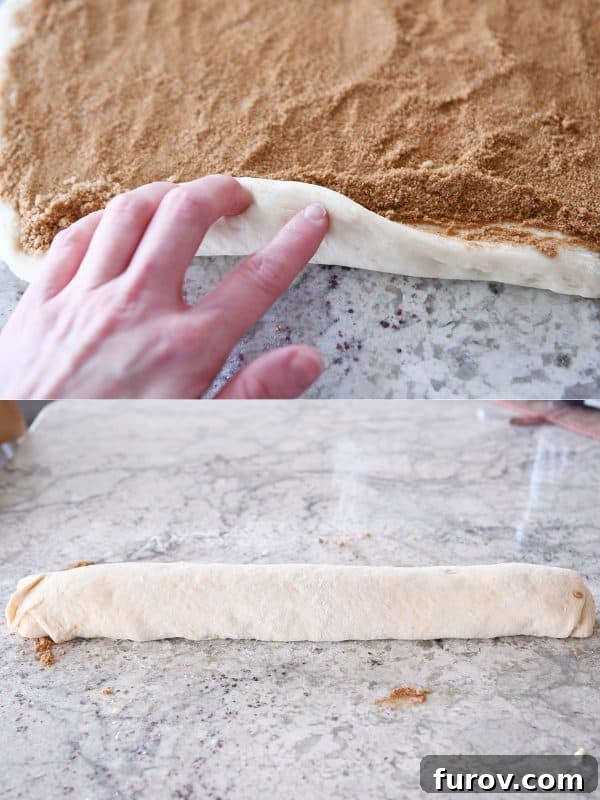 Master Cheryl's Famous Cinnamon Rolls: A Step-by-Step Guide to the Best Recipe and Baking Secrets 21 Hands carefully rolling a rectangle of cinnamon roll dough, filled with butter and cinnamon sugar, into a tight log.