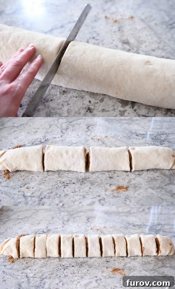 Master Cheryl's Famous Cinnamon Rolls: A Step-by-Step Guide to the Best Recipe and Baking Secrets 22 A serrated knife cleanly slicing a long log of cinnamon roll dough into individual portions on a cutting board.
