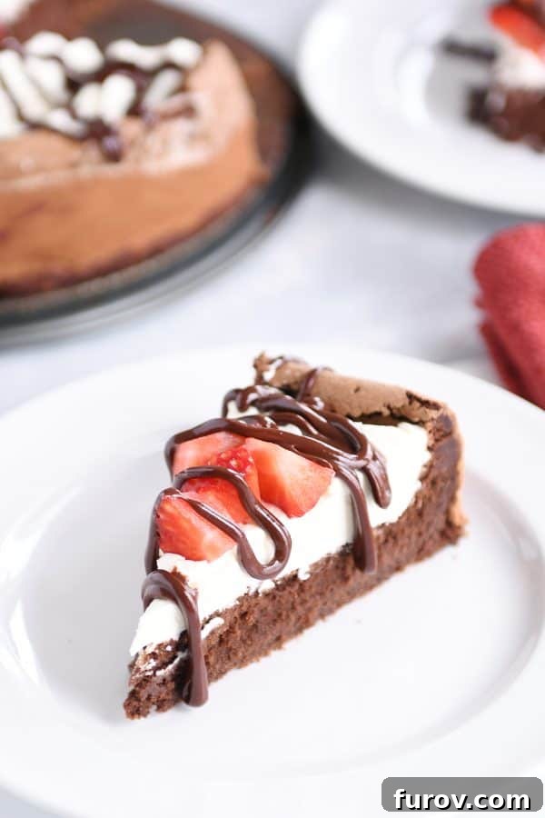 Deep Dark Chocolate Slump 4 Close-up of fallen chocolate cake with creamy whipped cream, vibrant strawberries, and a glossy chocolate ganache drizzle, emphasizing the rich chocolate texture.