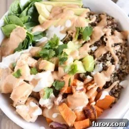 Landscape view Top down view of Buddha bowl recipe with peanut sauce.