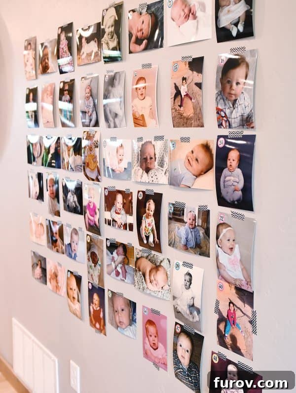 A wall decorated with numerous baby photos, part of a 