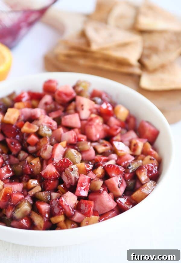 Vibrant Fruit Salsa with Cinnamon Sugar Crisps 2 White shallow bowl with mixed fruit salsa.