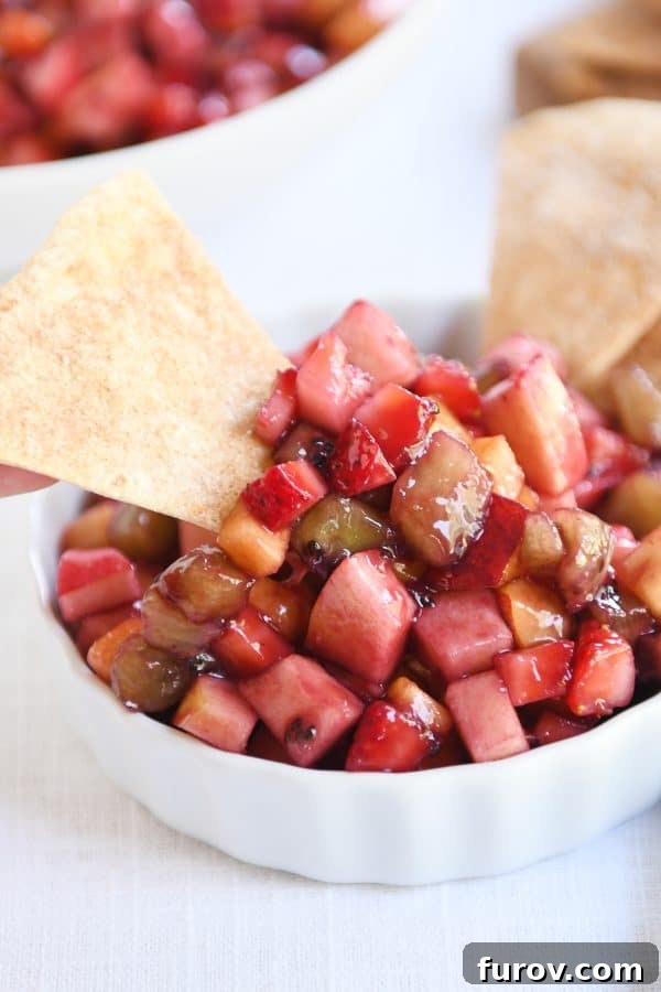 Vibrant Fruit Salsa with Cinnamon Sugar Crisps 3 Small white bowl with fruit salsa with baked cinnamon tortilla chips.