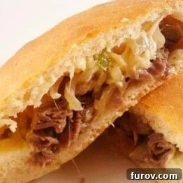 A small image of a golden-brown Philly Cheesesteak Calzone.