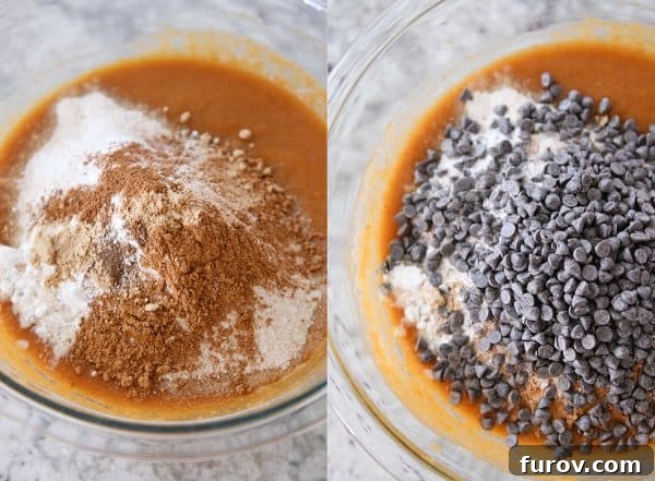 Close-up process shot of pumpkin chocolate chip snack cake batter being gently mixed in a bowl.