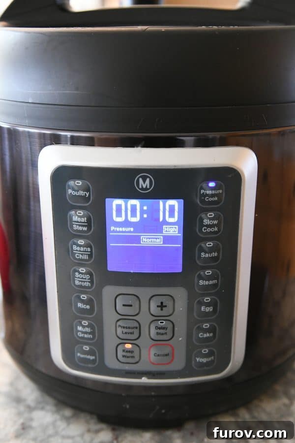 A Mealthy pressure cooker displaying a 10-minute cook time, ready to prepare the chowder.