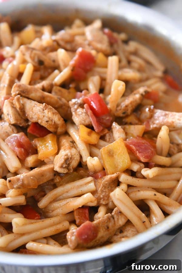 Fiesta Skillet Chicken Fajita Pasta 9 Skillet chicken fajita pasta fully combined and ready to be served, showcasing its vibrant ingredients.