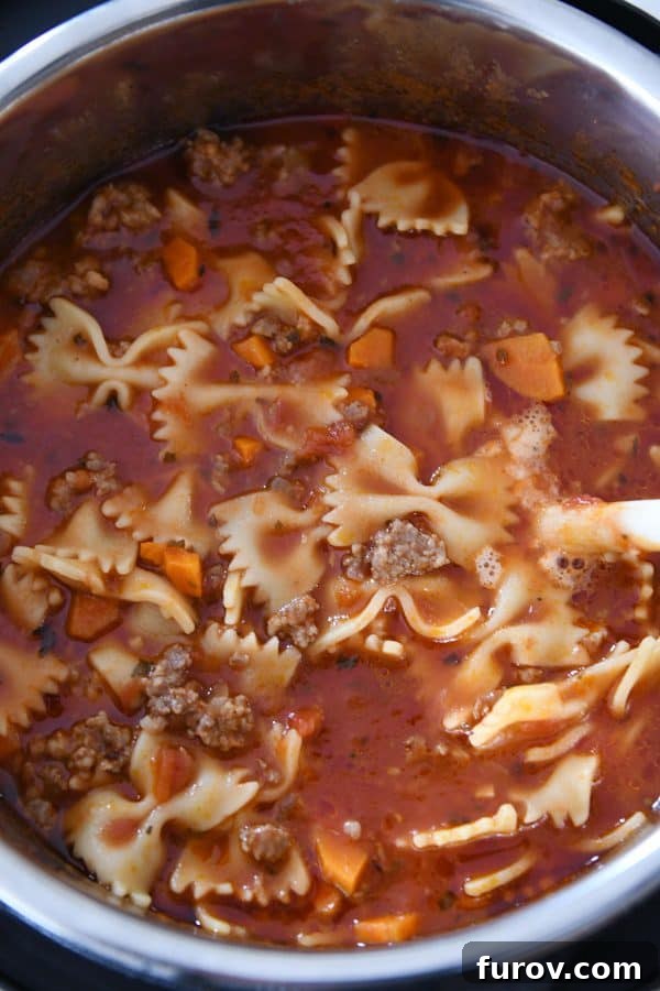 Homemade Lasagna Soup Pressure Cooker or Stovetop 6 The finished lasagna soup, rich and bubbly, steaming inside the pressure cooker, ready to be served.