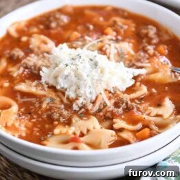Homemade Lasagna Soup Pressure Cooker or Stovetop 10 White bowl filled with pressure cooker lasagna soup and dollop of cheesy ricotta mixture.