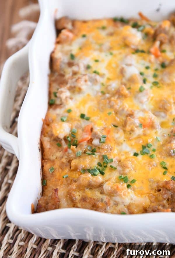 Baked make-ahead overnight tater tot breakfast casserole, golden brown and bubbling.