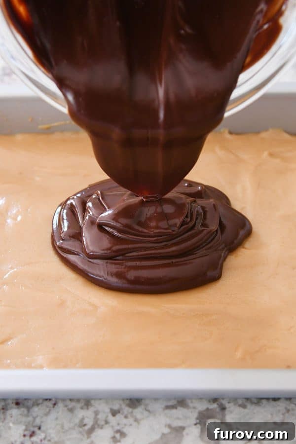Homemade Dulce de Leche Caramel Shortbread Bars 14 Pouring chocolate ganache on top of the set caramel layer in a baking pan.