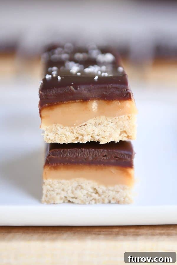 Homemade Dulce de Leche Caramel Shortbread Bars 16 Two homemade grown up Twix bars presented on a clean white tray.