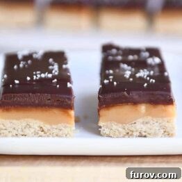 Two homemade grown up Twix bars on white tray, ready to be served.