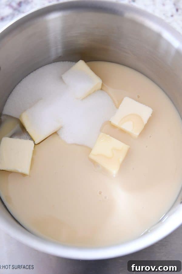 Homemade Dulce de Leche Caramel Shortbread Bars 7 Adding sweetened condensed milk, butter, and sugar to a pot for homemade caramel.