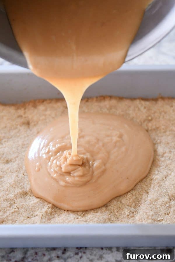 Homemade Dulce de Leche Caramel Shortbread Bars 10 Pouring homemade caramel on top of the baked shortbread crust.