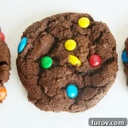 A plate of freshly baked Double Chocolate M&M Cookies, ready to be served.