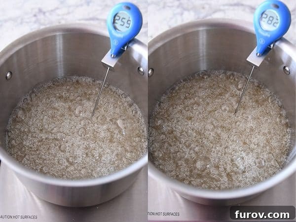 Sugar syrup cooking in a metal pot, with a candy thermometer showing the rising temperature, a crucial step for achieving the perfect caramel.