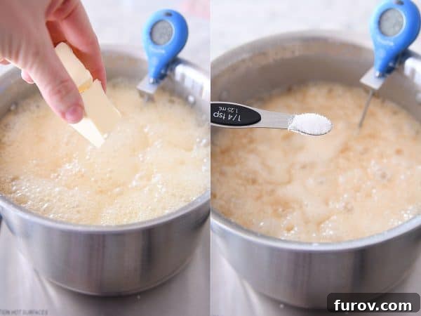 Butter and salt being added to a simmering caramel mixture, enhancing its flavor and texture.