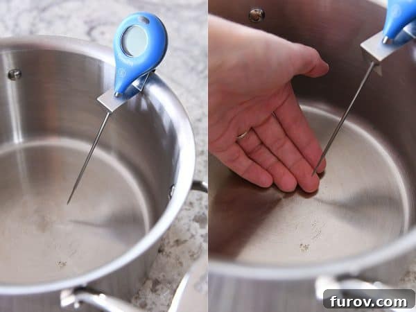 A candy thermometer precisely clipped to the side of a heavy-bottomed pan, ensuring accurate temperature readings.
