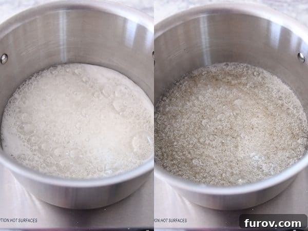 Sugar syrup gently cooking in a metal pot, transforming into a clear, bubbling liquid for caramels.