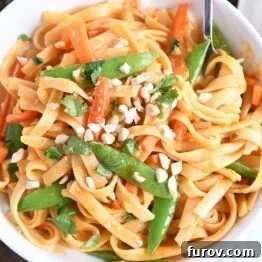 Deliciously Inauthentic Instant Pot Red Coconut Curry Noodles 11 twirling instant pot red coconut curry noodles with fork in white bowl