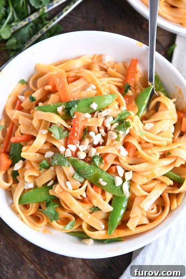 Deliciously Inauthentic Instant Pot Red Coconut Curry Noodles 9 Twirling instant pot red coconut curry noodles with fork.