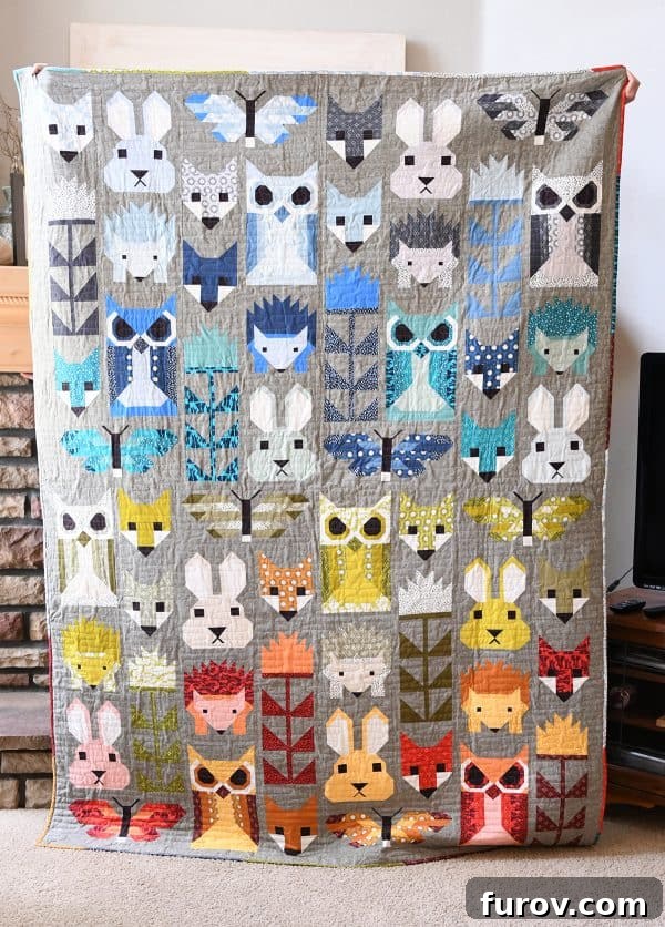 Intricately designed Fancy Forest quilt with various animal and tree motifs.