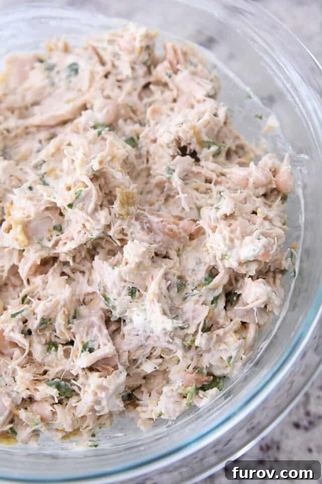 Glass bowl with creamy enchilada filling.