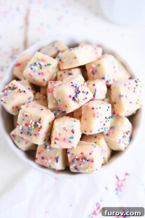 Top down view of baked funfetti shortbread bites in a rustic white bowl, ready for serving and enjoying.