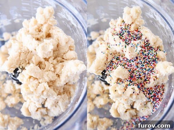 Close-up shot of colorful nonpareil sprinkles being gently folded into the shortbread dough, creating the funfetti effect.