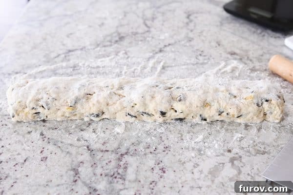 Decadent Chocolate Chip Banana Bread Scones 6 Shaping scone dough into long rectangle.
