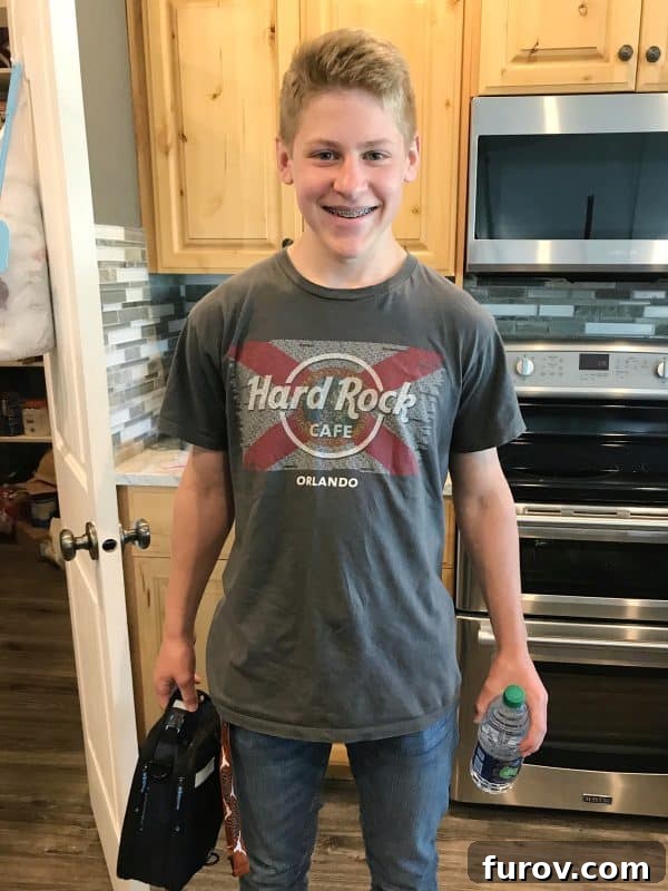 Teenager carrying lunch and water bottle, ready for a new summer job, symbolizing growing independence