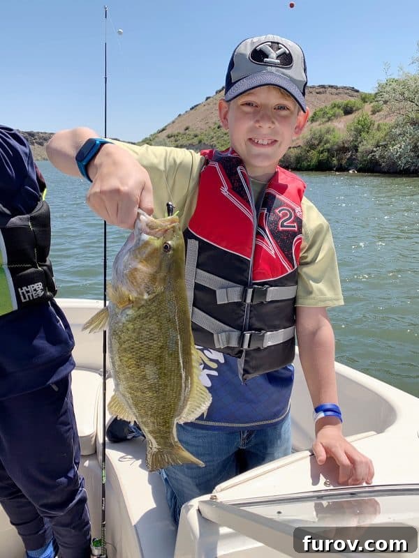 Kids on a boat, excitedly catching fish, demonstrating a classic summer activity and enjoying nature