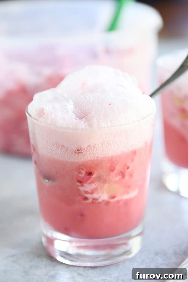 Pink Paradise Sorbet 10 Fruity pink sorbet in glass with ginger ale.