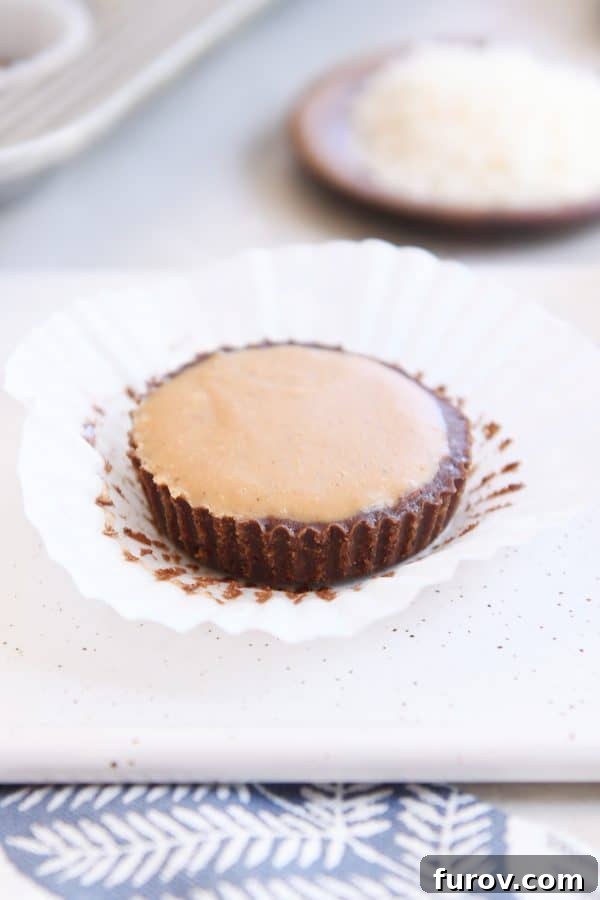 Irresistible No-Bake Peanut Butter Cups: Vegan, Gluten-Free Indulgence 11 A single unwrapped no-bake peanut butter cup, showcasing its inviting texture and rich layers.