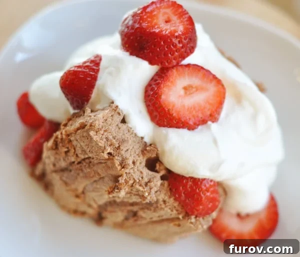 Heavenly Angel Food Cake Classic and Chocolate Flavors 2 Large slice of angel food cake topped with whipped cream and sliced strawberries.