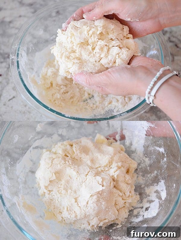 Unlock the Secret to Flaky Homemade Pie Crust 11 Pie crust dough being gathered together in a glass bowl, showing its shaggy but cohesive texture.