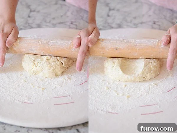 Unlock the Secret to Flaky Homemade Pie Crust 15 A wooden rolling pin rolling out a disc of pie crust dough on a floured surface.