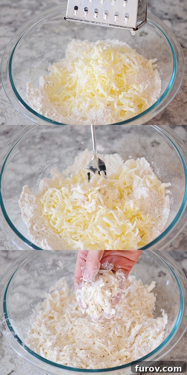 Unlock the Secret to Flaky Homemade Pie Crust 9 Grated butter evenly mixed into a glass bowl of dry ingredients.