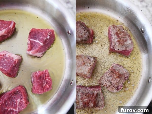 Fall-Apart Tender Slow Cooker Beef in Rich Gravy 6 Searing beef chunks in hot oil in a skillet, creating a flavorful crust.