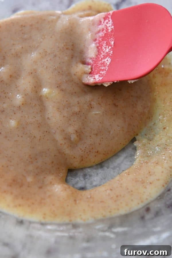 Cooled brown butter in glass bowl.