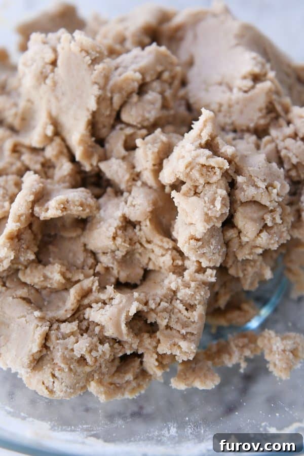 Brown butter snickerdoodle dough in glass bowl.