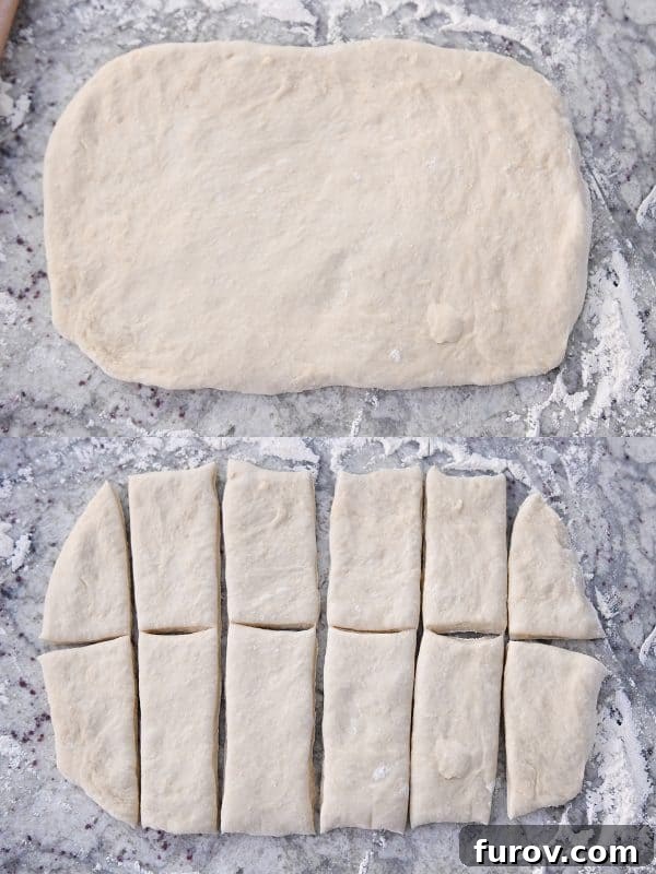 Process of rolling dough into a rectangle and then cutting it into 12 rectangular pieces for Parker House style rolls.