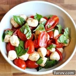 Vibrant Cherry Tomato Caprese 4 Overhead shot of a colorful Caprese salad in a bowl.