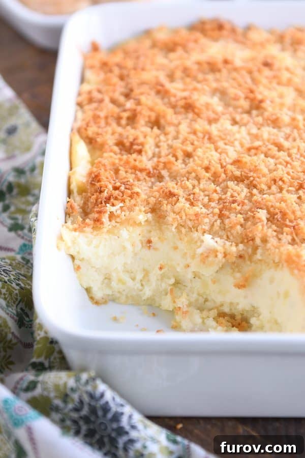 White pan with mashed potatoes and crispy topping.
